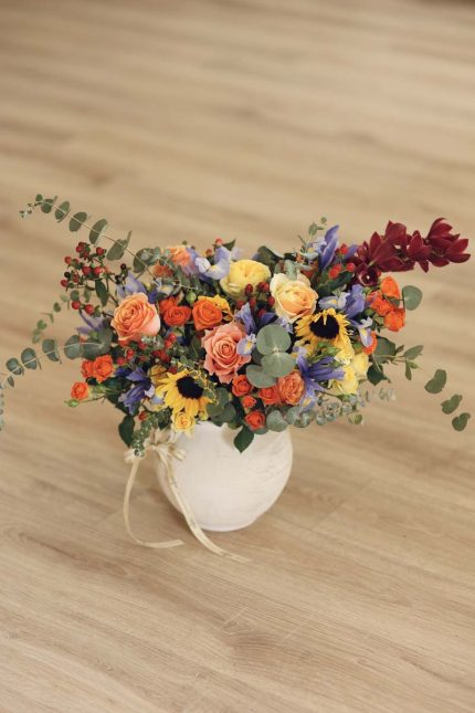 Patina vase with mixed flowers
